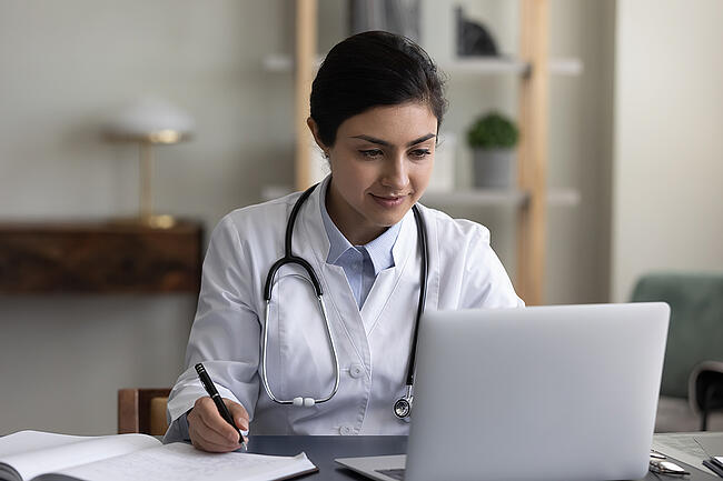 Nursing manager working on creating a unit schedule.