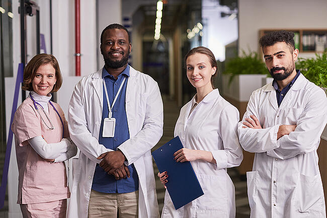 Medical healthcare facility team standing in a healthcare facility.