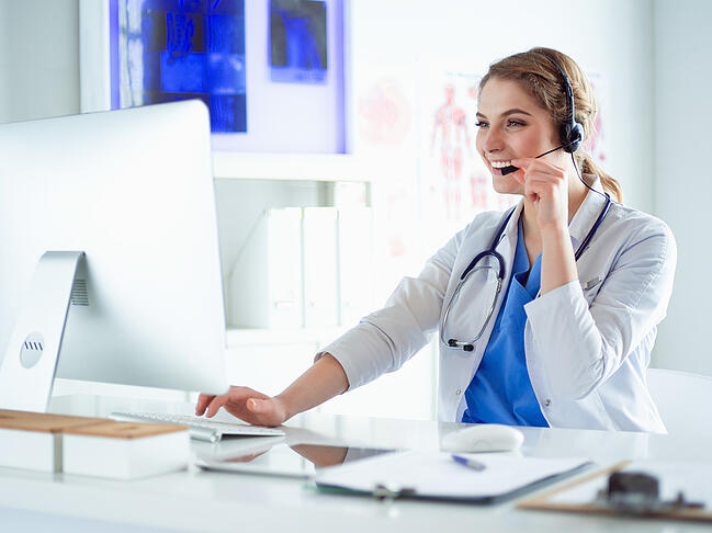 A nurse scheduler using employee scheduling software for her unit.