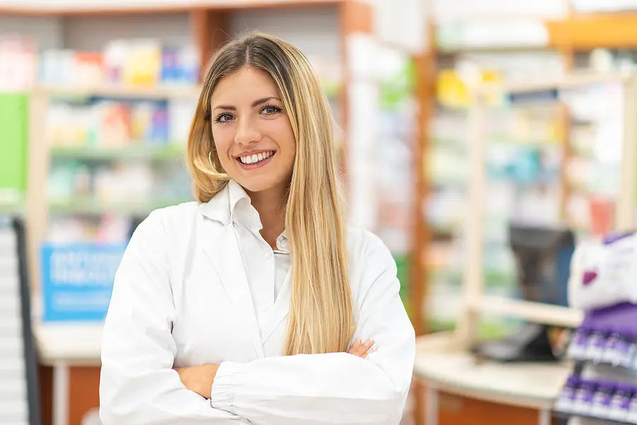 Pharmacist standing in a pharmacy with a blurred background 