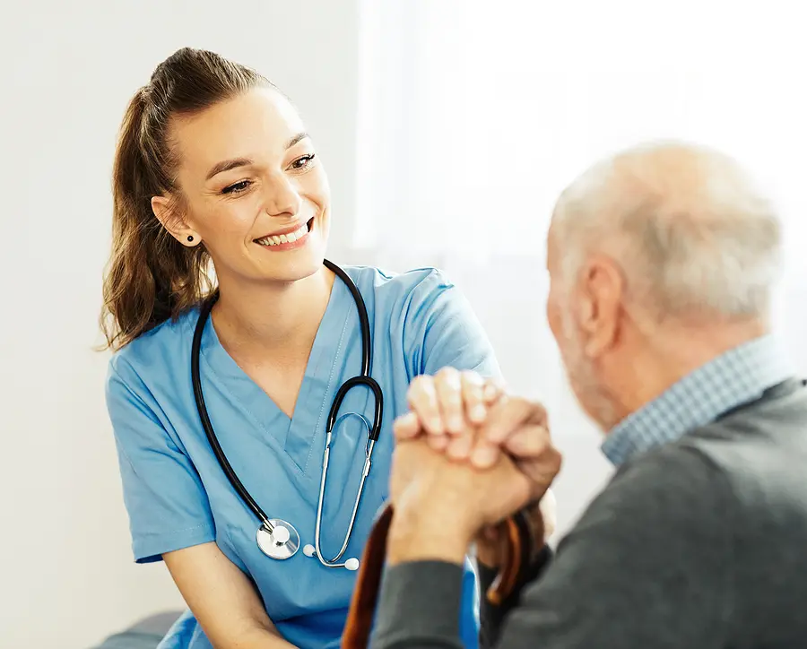 Nurse talking to an elderly patient. 